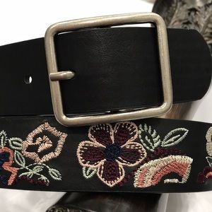 EMBROIDERY BELT.Dark brown man made material w brushed silver tone buckle.FLORAL